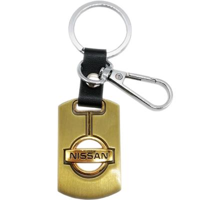 Брелок металлический с гравировкой NISSAN хром с позолотой /14498/
