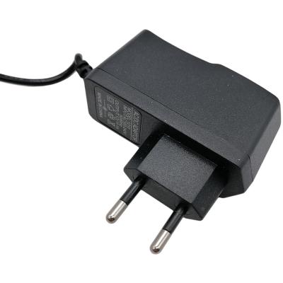 Блок питания импульсный 12,0V,  1,0A, 12W вилка на блоке /90140/**